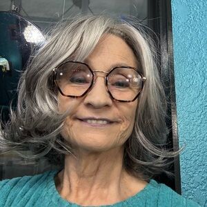 Godiva’s Secret Wigs Monroe style that is a Elegant Silver Gray Women's Wig.